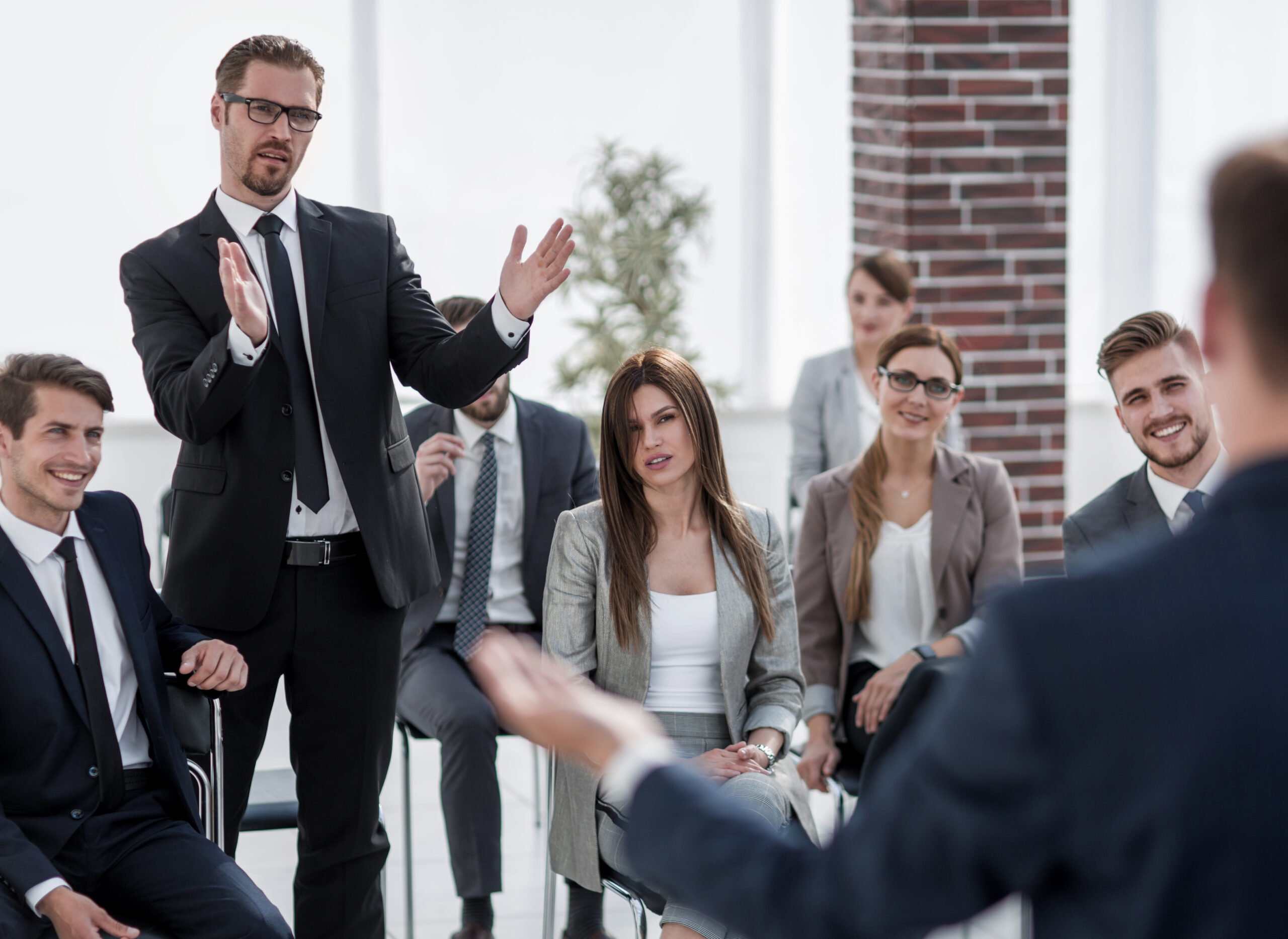 young businessman asks the speaker at a business meeting.business concept